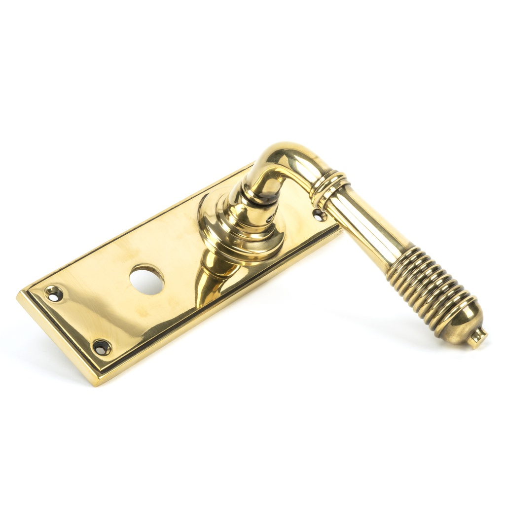 Aged Brass Reeded Lever Bathroom Set in-situ