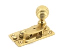 Polished Brass Beehive Sash Hook Fastener in-situ