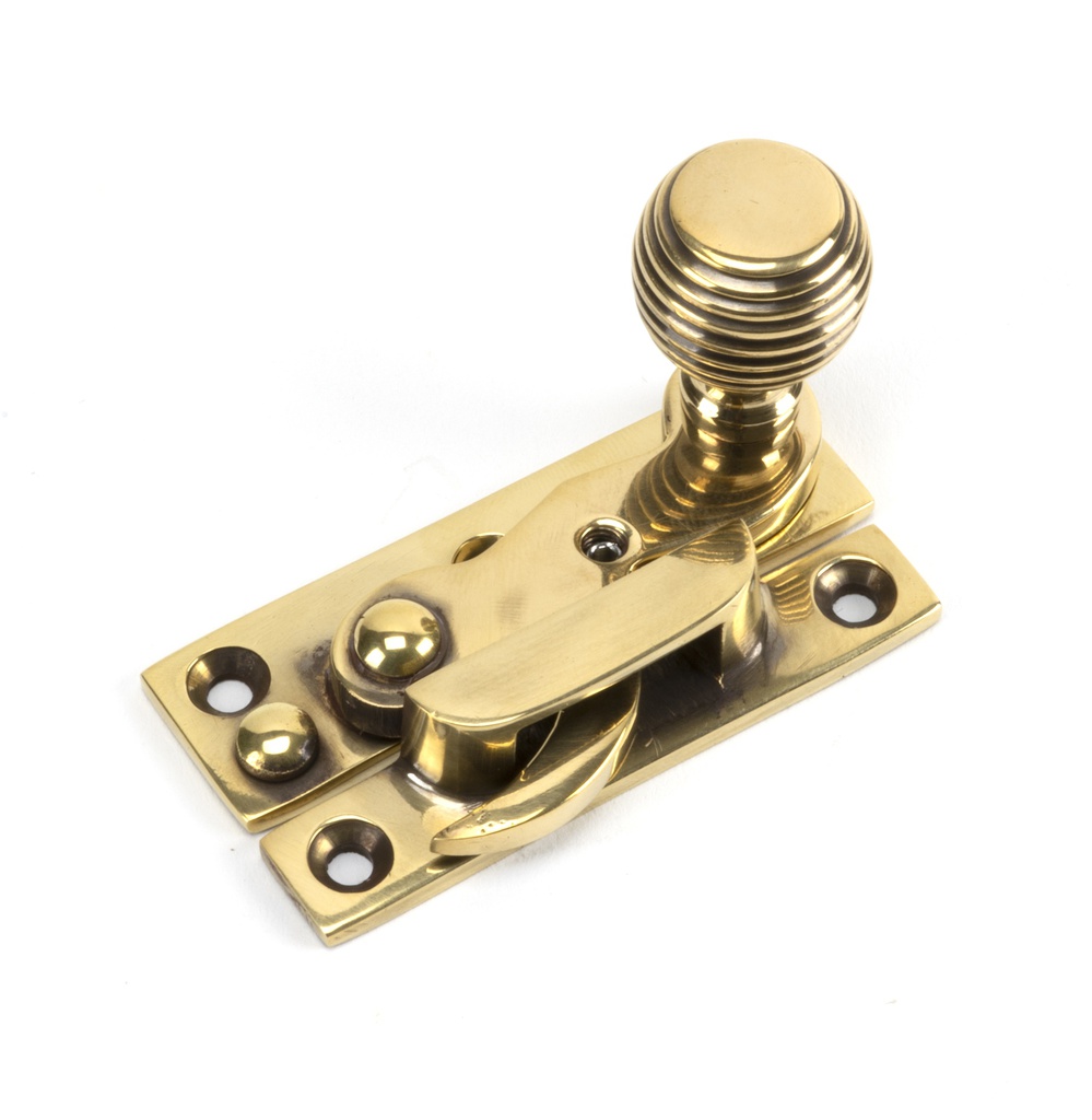 Aged Brass Beehive Sash Hook Fastener in-situ