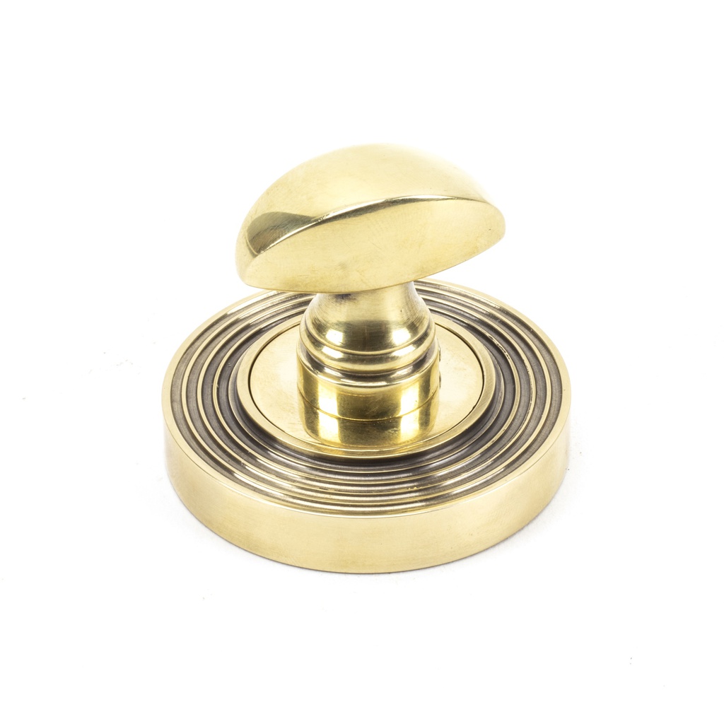 Aged Brass Round Thumbturn Set (Beehive) in-situ